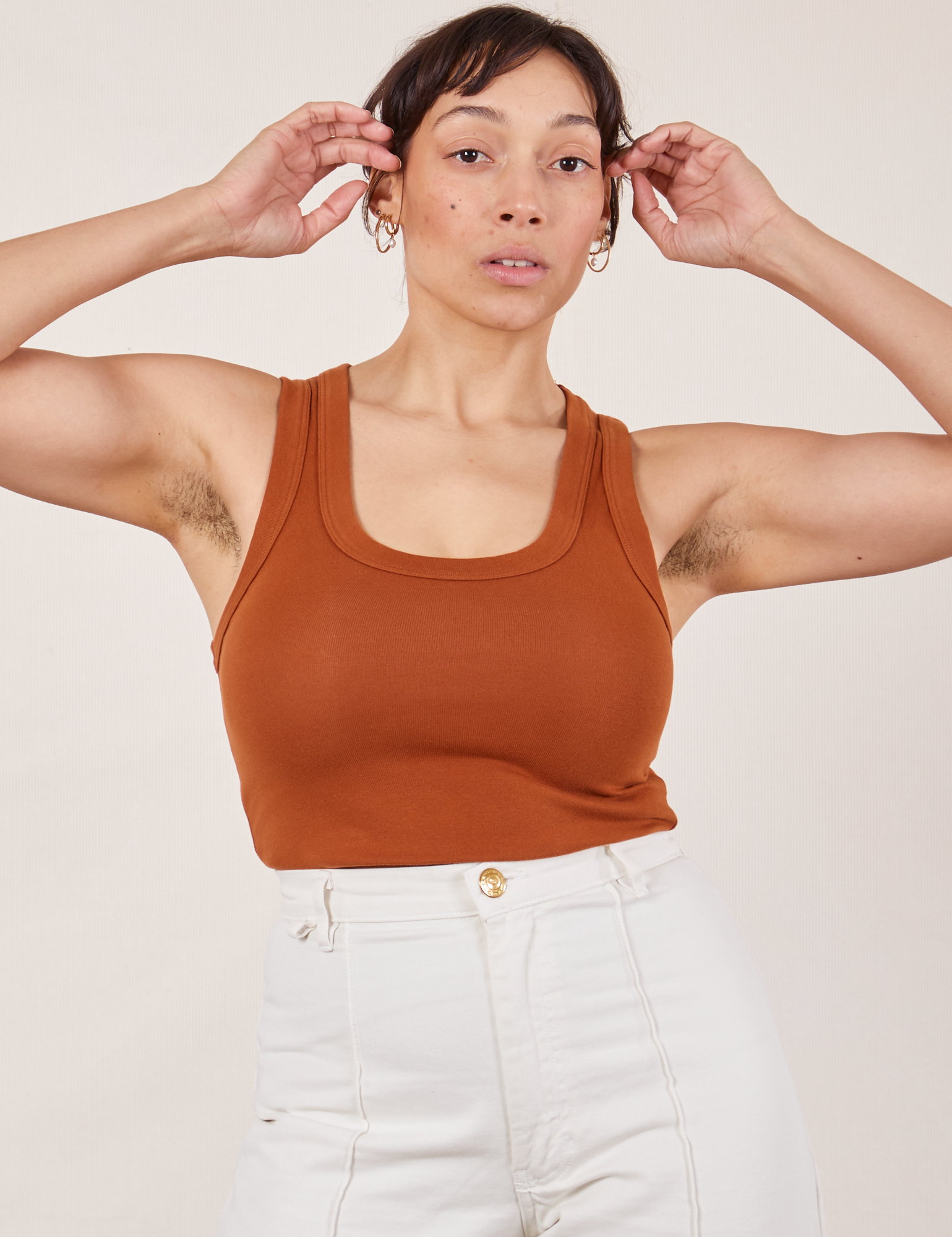 Tiara is wearing Tank Top in Burnt Terracotta