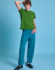 Quinn is wearing Checkerboard Work Pants in Blues and lawn green Organic Vintage Tee