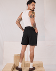 Back view of Trouser Shorts in Basic Black and Tank Top in vintage tee off-white on Jesse