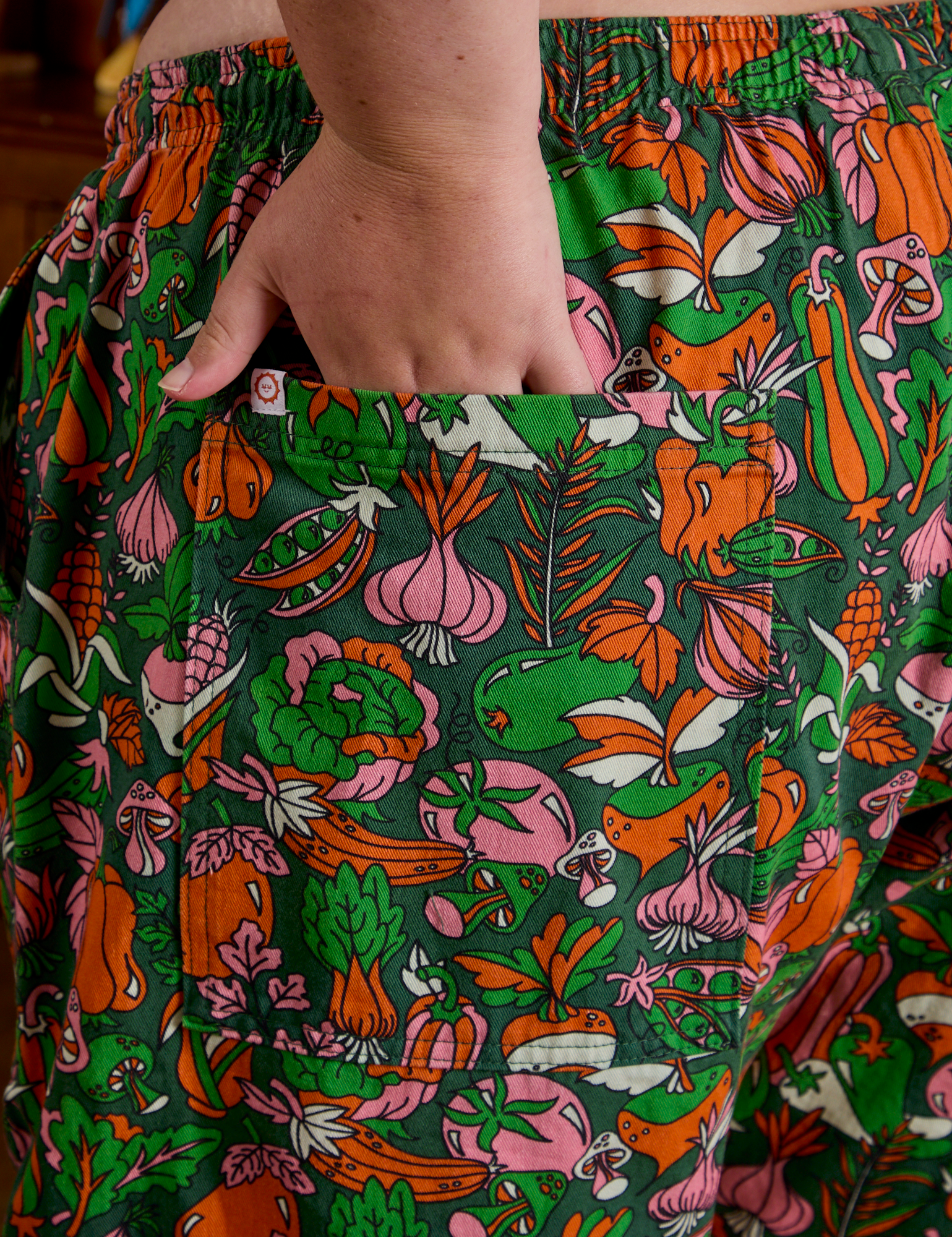 Close up of Juliet's hand in the back pocket of Drop Pocket Cargo Pants in Kitchen Collection