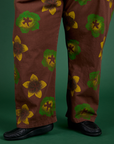 Floral Painted Work Pants in Brown pant leg close up on Sam