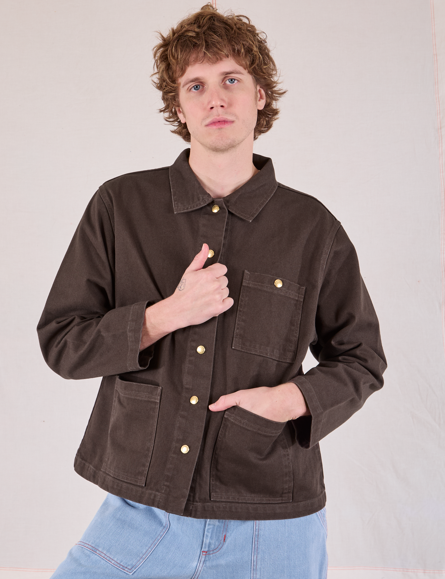 Quinn is wearing a buttoned up Denim Work Jacket in Espresso Brown