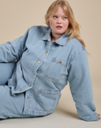 Juliet is wearing Indigo Denim Work Jacket in Light Wash