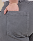Close up of Ashley's hand in the back pocket of Work Pants in Washed Grey