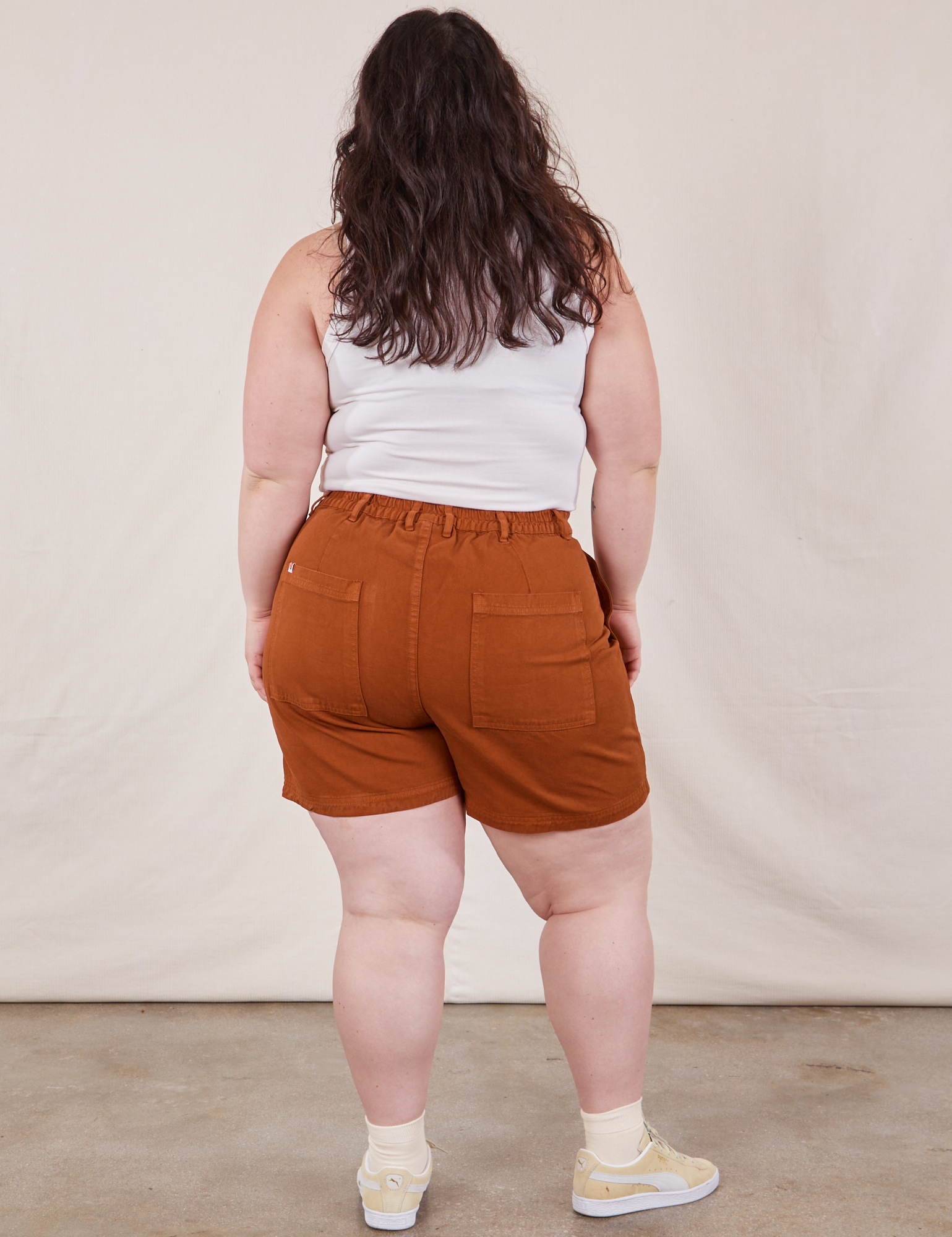 Back view of Classic Work Shorts in Burnt Terracotta and Cropped Tank Top in vintage tee off-white on Ashley