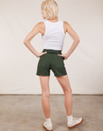 Back view of Classic Work Shorts in Swamp Green and Cropped Tank Top in vintage tee off-white on Madeline