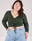 Ashley is 5'7" and wearing size 4 Wrap Top in Swamp Green