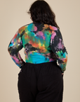 Long Sleeve Baby Tee in Rainbow Magic Waters back view on Ashley