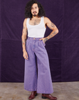 Jesse is 5'8" and wearing XXS Overdyed Wide Leg Trousers in Faded Grape paired with Cropped Tank Top in vintage tee off-white