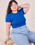 Ashely is wearing Baby Tee in Royal Blue and light wash Trouser Jeans