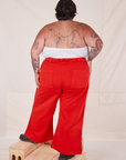 Back view of Bell Bottoms in Mustang Red and Halter Top in vintage tee off-white on Sam