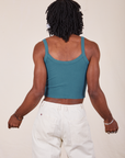 Back view of Cropped Cami in Marine Blue and vintage tee off-white Western Pants worn by Jerrod