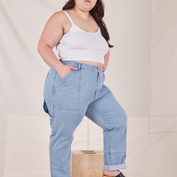Side view of Carpenter Jeans in Light Wash worn by Ashley