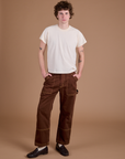 Quinn is 6’3” and wearing M Carpenter Jeans in Fudgesicle Brown paired with the Organic Vintage Tee in Vintage Tee Off-White