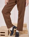 Checker Trousers in Brown & Black pant leg close up on Alex