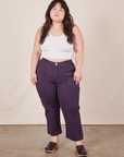 Ashley is 5'7" and wearing 1XL Petite Work Pants in Nebula Purple and Halter Top in vintage tee off-white