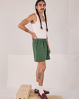 Side view of Easy Shorts in Dark Emerald Green and Tank Top in vintage tee off-white on Anthony
