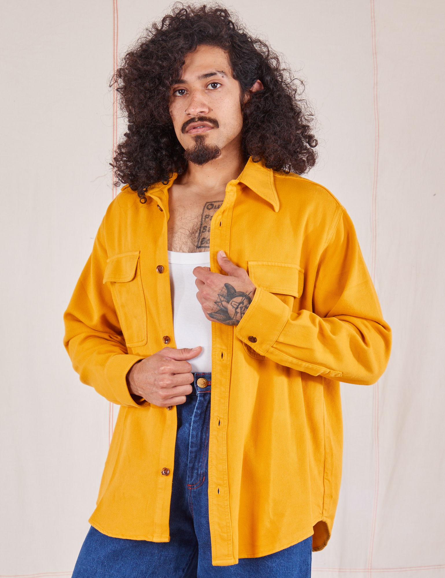 Jesse is 5&#39;8&quot; and wearing XS Flannel Overshirt in Mustard Yellow