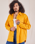 Jesse is 5'8" and wearing XS Flannel Overshirt in Mustard Yellow