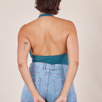 Back view of Halter Top in Marine Blue and light wash Sailor Jeans worn by Tiara