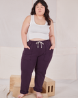 Ashley is 5'7" and wearing L Rolled Cuff Sweat Pants in Nebula Purple paired with vintage off-white Cropped Tank
