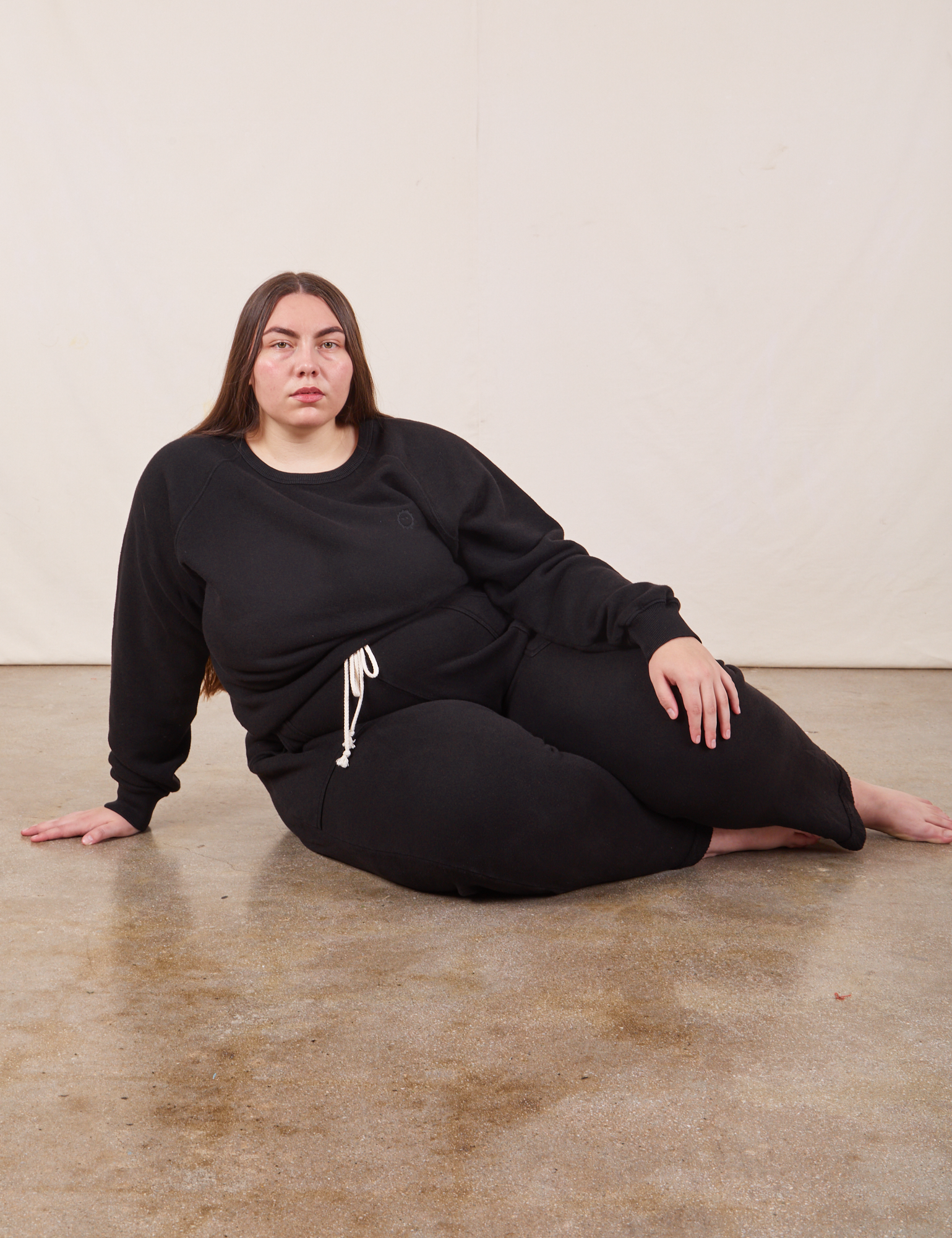 Marielena is wearing Heavyweight Crew in Basic Black and Cropped Rolled Cuff Sweatpants
