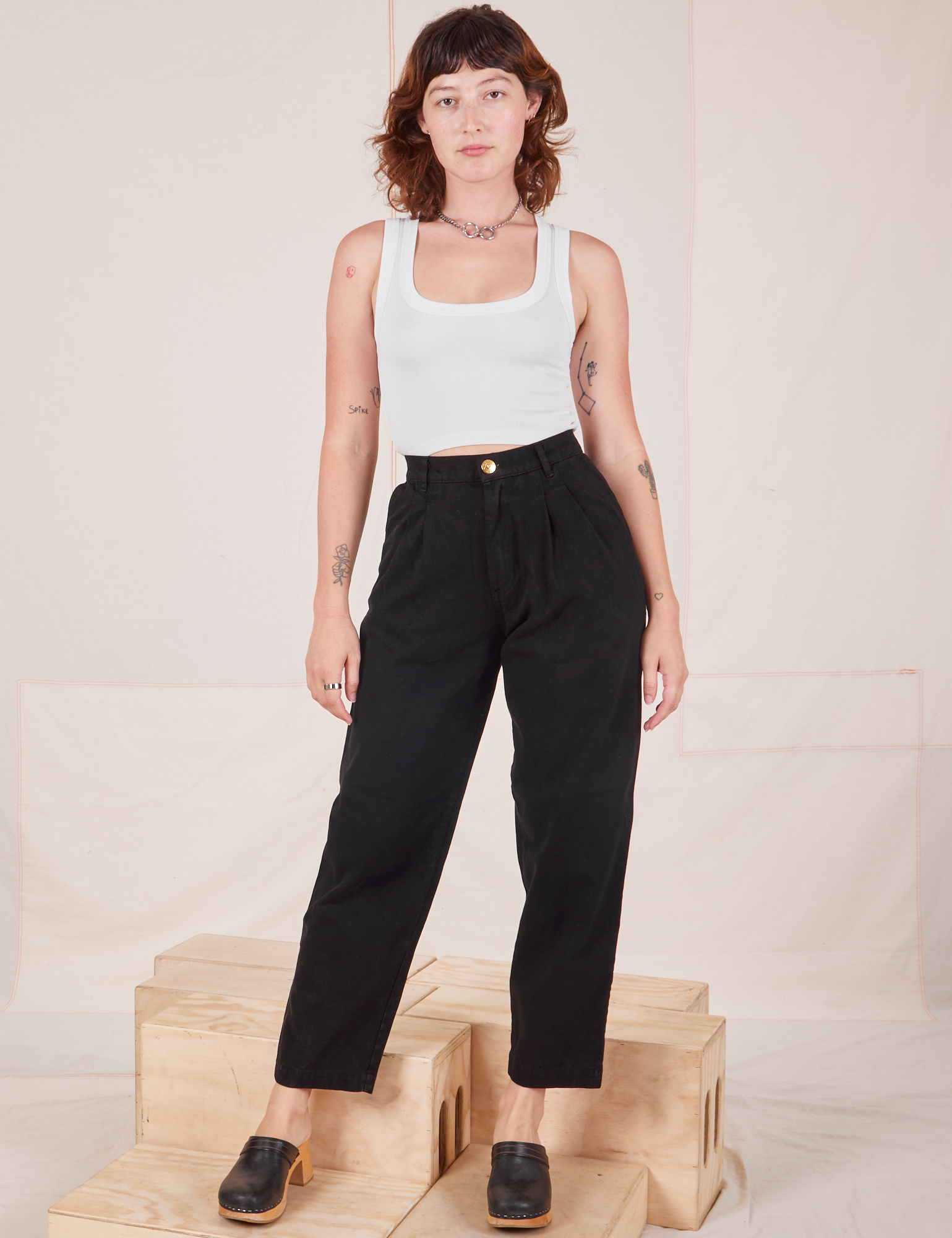 Alex is 5&#39;8&quot; and wearing XXS Heavyweight Trousers in Basic Black paired with Cropped Tank Top in vintage tee off-white