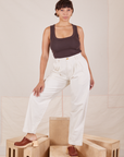 Tiara is 5'4" and wearing S Heavyweight Trousers in Vintage Tee Off-White paired with espresso brown Cropped Tank Top.