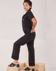 Heritage Short Sleeve Jumpsuit in Basic Black side view on Mika