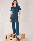 Alex is 5'8" and wearing XXS Heritage Short Sleeve Jumpsuit in Lagoon