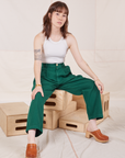 Hana is wearing Heavyweight Trousers in Hunter Green and Halter Top in vintage tee off-white