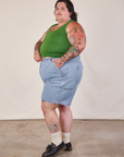 Side view of Carpenter Shorts in Light Wash and lawn green Cropped Tank on Sam