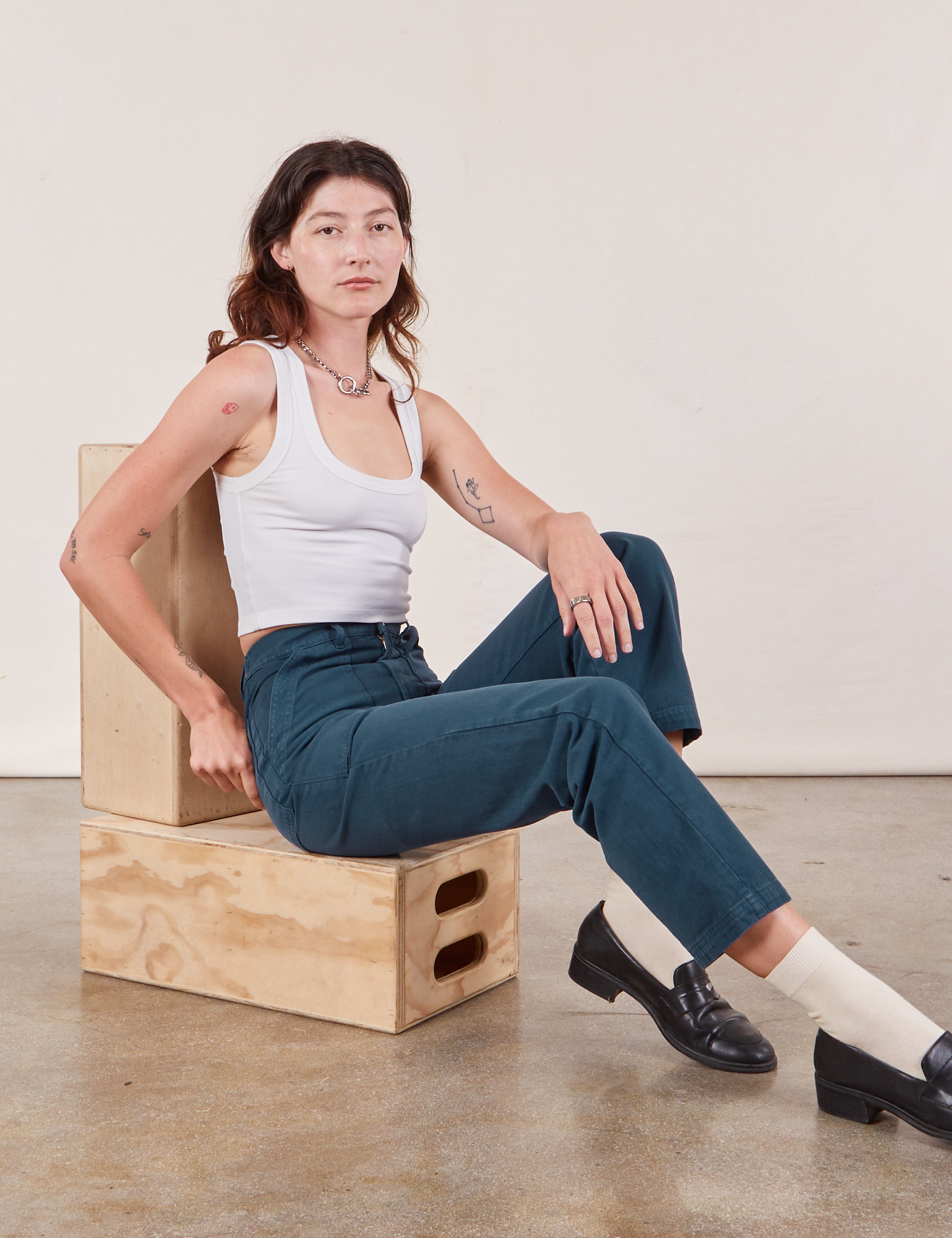 Alex is wearing Work Pants in Lagoon and vintage tee off-white Cropped Tank