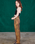 Side view of Leopard Work Pants and black Halter Top on Hana