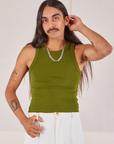 Anthony is 5’10” and wearing S Racerback Tank in Summer Olive