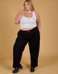 Baggy Mid-Rise Trousers in Basic Black and vintage tee white Cropped Tank on Juliet