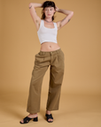 Alex is wearing Baggy Mid-Rise Trousers in Desert Brown and vintage tee white Cropped Tank