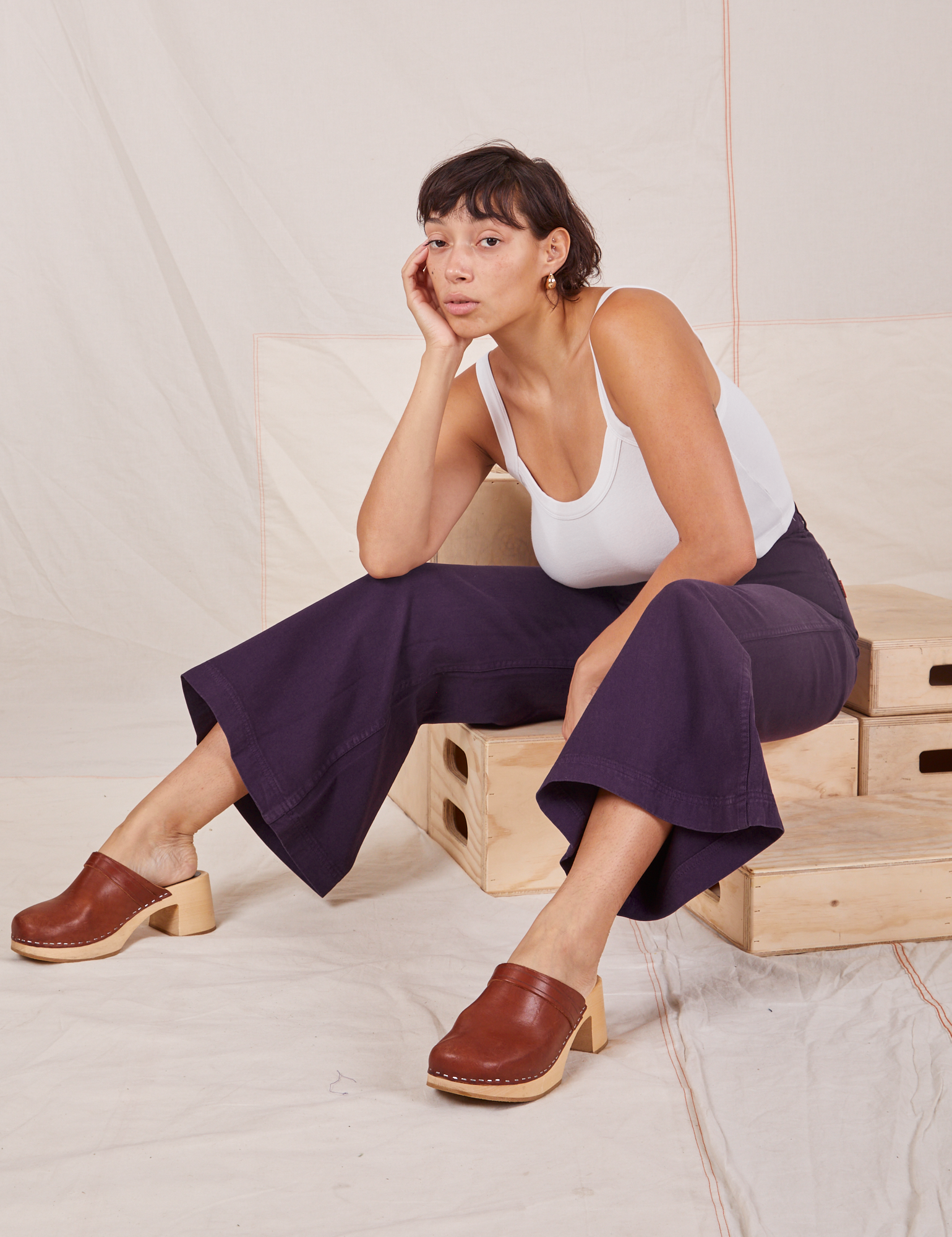 Tiara is wearing Bell Bottoms in Nebula Purple and Cropped Cami in vintage tee off-white