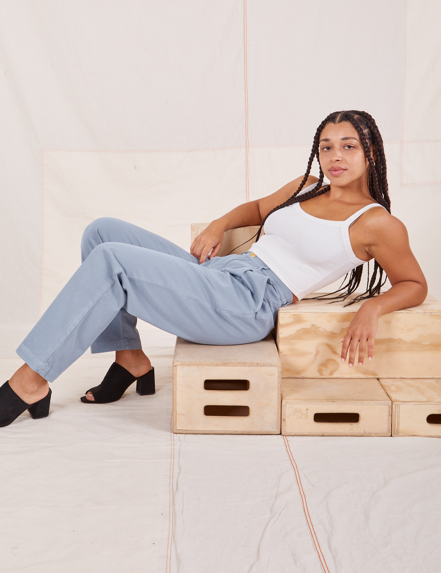 Gabi is wearing Organic Trousers in Periwinkle and Cropped Cami in vintage tee off-white