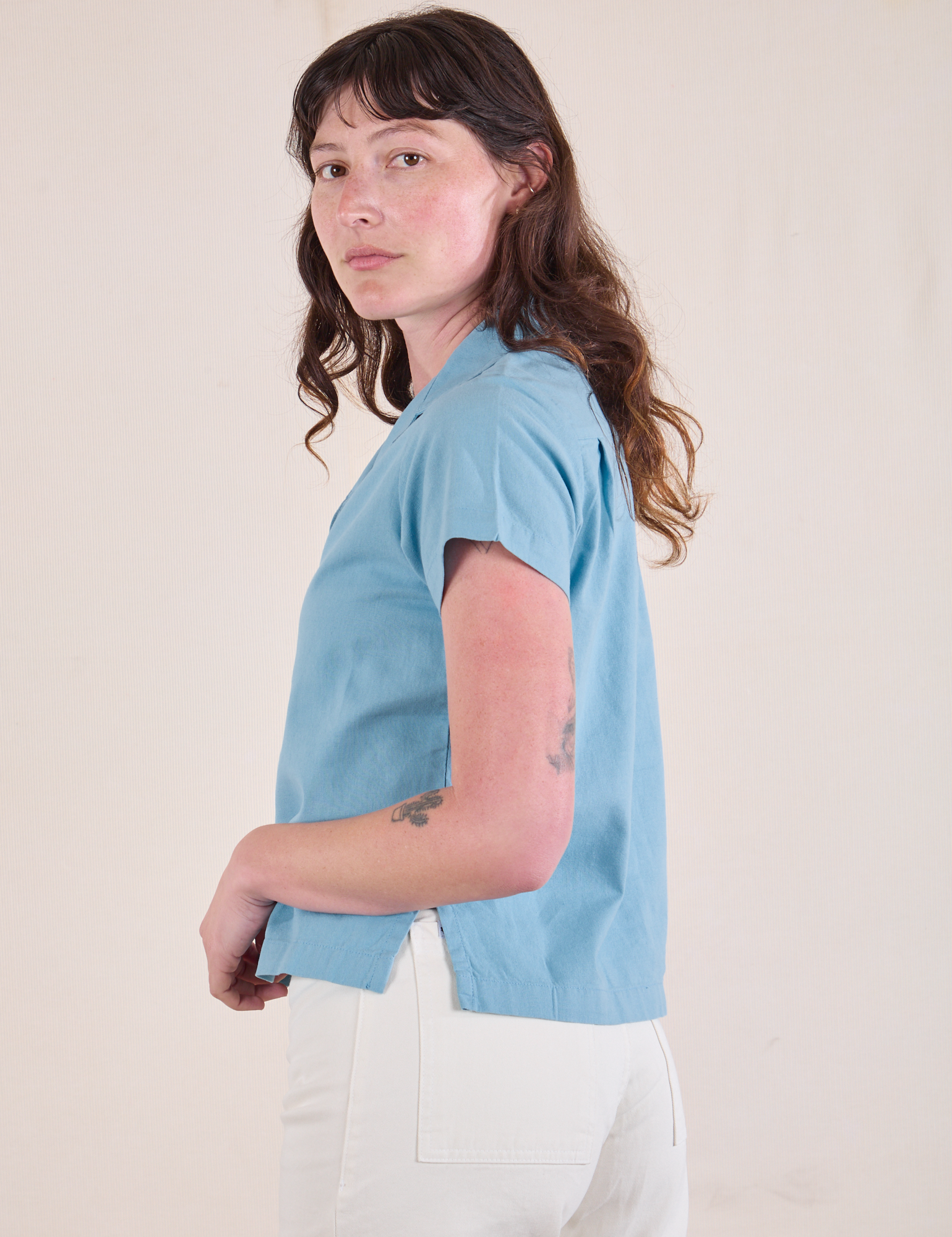 Side view of Pantry Button-Up in Baby Blue on Alex