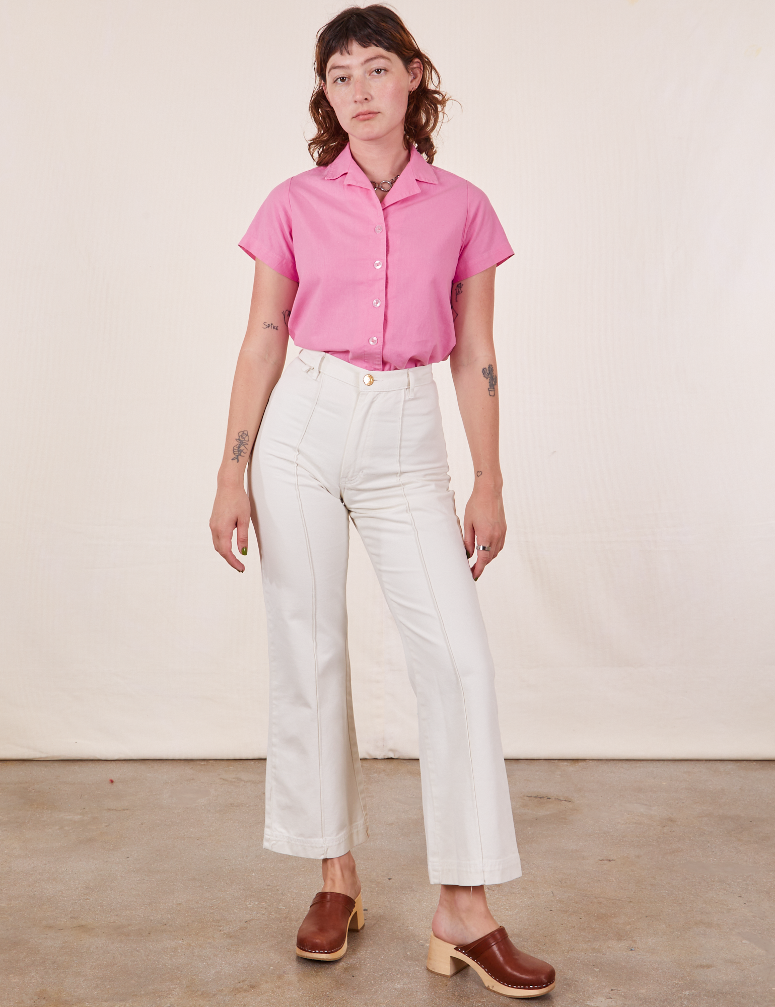 Alex is wearing Pantry Button-Up in Bubblegum Pink and vintage tee off-white Western Pants