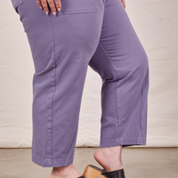 Pant leg close up side view of Petite Short Sleeve Jumpsuit in Faded Grape worn by Ashley