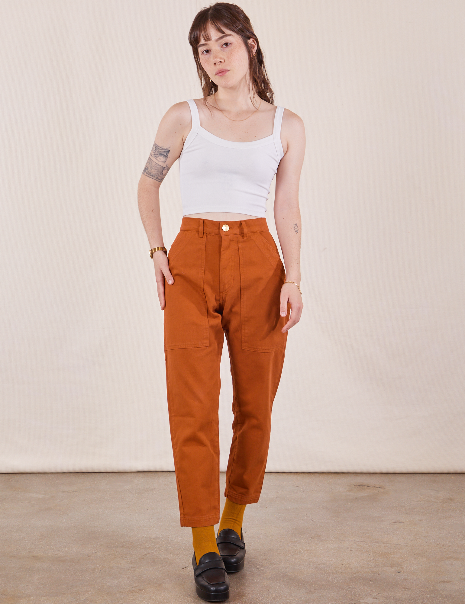 Hana is 5&#39;3&quot; and wearing XXS Petite Pencil Pants in Burnt Terracotta paired with Cropped Cami in vintage tee off-white