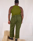 Back view of Railroad Carpenter Jeans in Summer Olive and Muscle Tee on Elijah