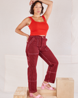 Tiara is wearing Railroad Carpenter Jeans in Mustang Red and mustang red Square Neck Tanks