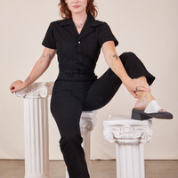 Alex is wearing Short Sleeve Jumpsuit in Basic Black