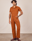 Jesse is wearing Short Sleeve Jumpsuit in Burnt Terracotta