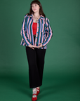 Sydney is wearing Stripe Work Jacket in Pacific Stripe paired with black Work Pants