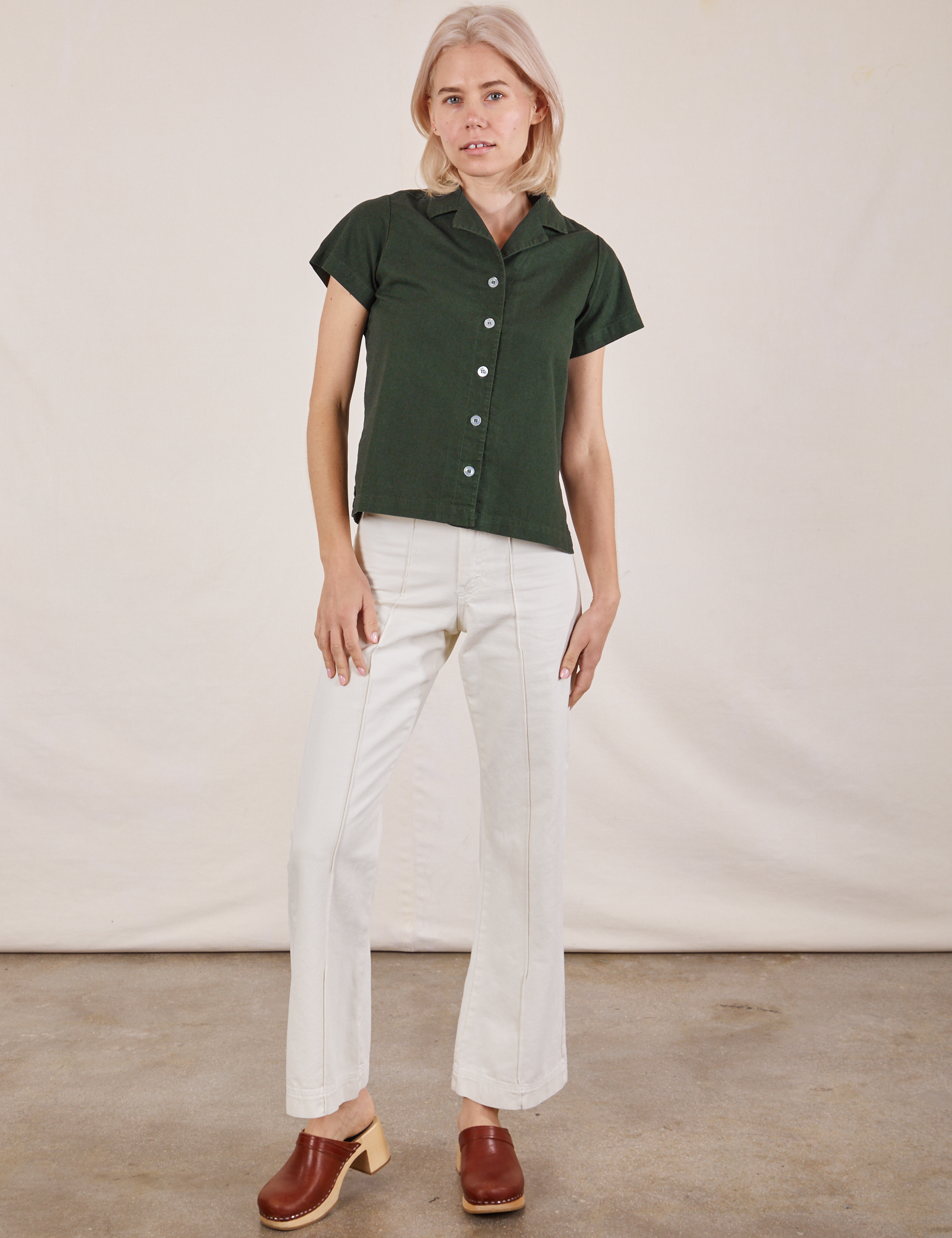 Madeline is wearing Pantry Button-Up in Swamp Green and vintage tee off-white Western Pants