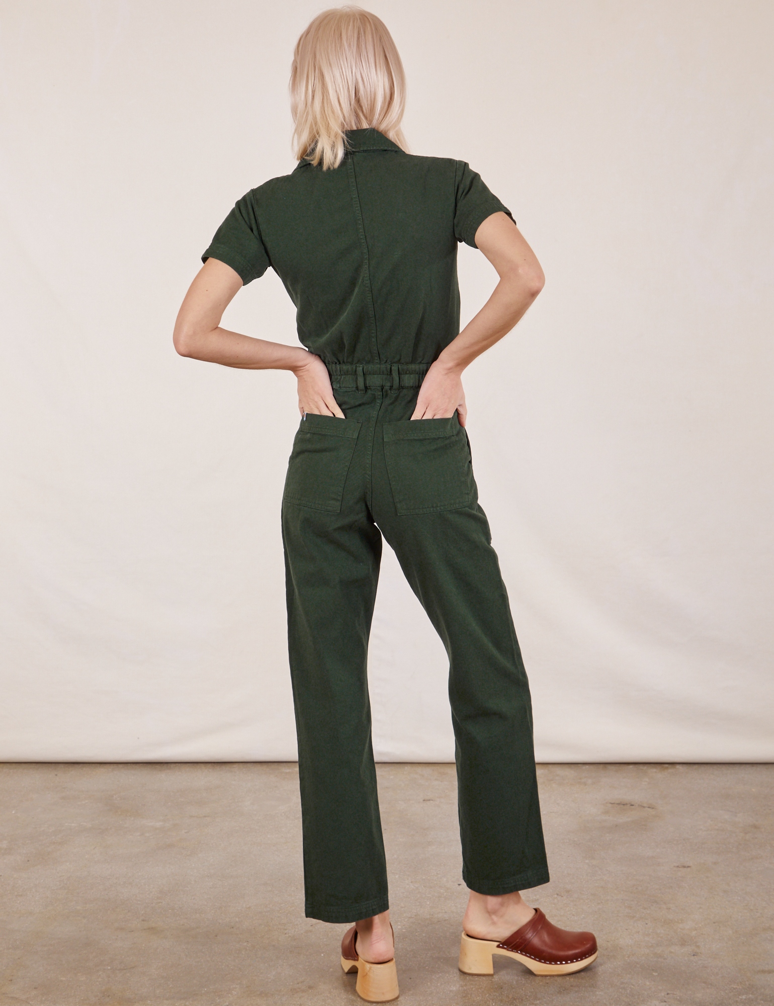 Short Sleeve Jumpsuit in Swamp Green back view on Madeline